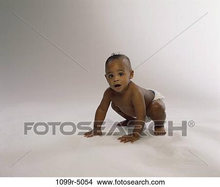 people, baby, curious, brunette, indoors, crouching, African-American View Large Photo Image Picture - people, baby, curious, brunette, indoors, crouching, African-American. Fotosearch