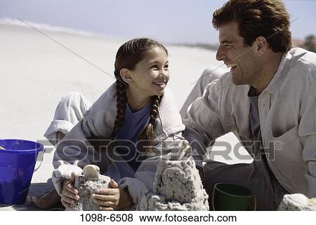 people, beach, family, father, daughter, brunette View Large Photo Image Stock Photo - people, beach, family, father, daughter, brunette. Fotosearch