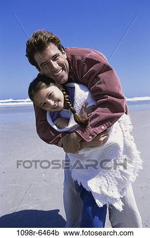 people, beach, hugging, family, hug, father, daughter View Large Photo Image Stock Image - people, beach, hugging, family, hug, father, daughter. Fotosearch