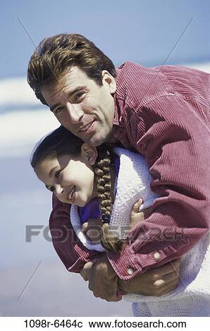 Stock Image - people, beach, hugging, family, hug, father, daughter. Fotosearch
