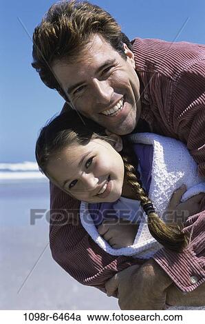 Stock Image - people, beach, hugging, family, affection, hug, father. Fotosearch