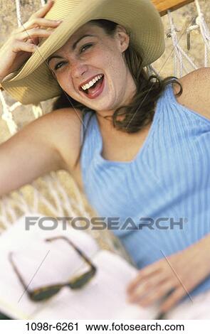 people, blur, woman, hat, reading, hammock, book View Large Photo Image Stock Image - people, blur, woman, hat, reading, hammock, book. Fotosearch