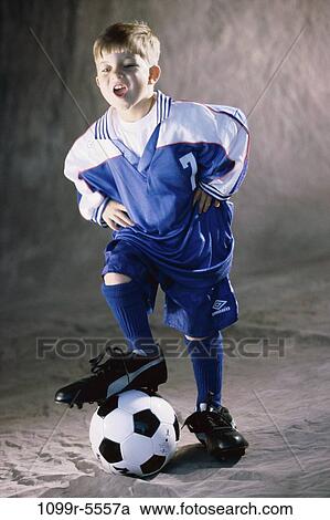 Stock Image - people, boy, child, blond, uniform, indoors, soccer. Fotosearch