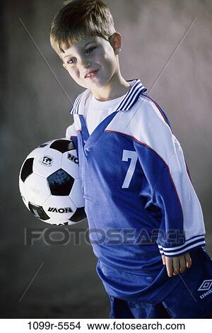 people, boy, child, uniform, brunette, indoors, soccer View Large Photo Image Picture - people, boy, child, uniform, brunette, indoors, soccer. Fotosearch