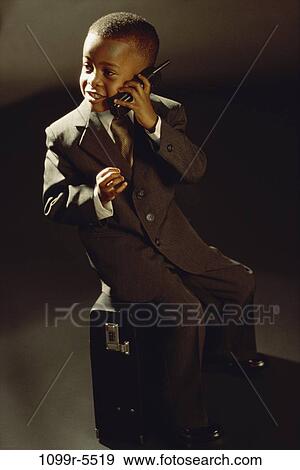 people, briefcase, suit, talking, phone, boy, business View Large Photo Image Stock Photo - people, briefcase, suit, talking, phone, boy, business. Fotosearch