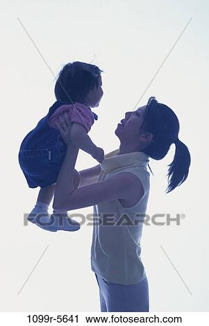 people, Brown, Asian, mother, playful, family, parent View Large Photo Image Stock Image - people, Brown, Asian, mother, playful, family, parent. Fotosearch