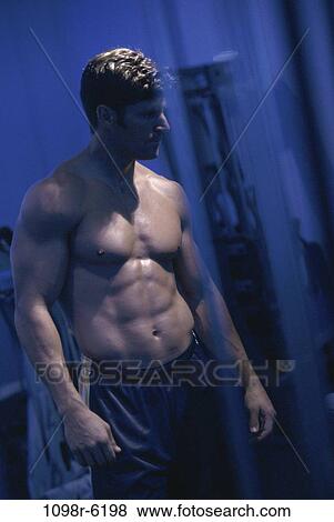 Stock Photo - people, brunette, muscular, indoors, muscles. Fotosearch