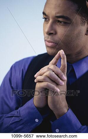 Stock Photo - people, business, Middle-aged, serious, contemplating, businessman. Fotosearch