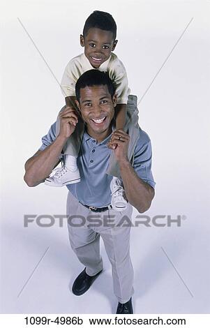 people, carrying, family, father, shoulders, parent View Large Photo Image Stock Image - people, carrying, family, father, shoulders, parent. Fotosearch