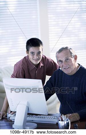 people, computer, teamwork, family, using, grandfather, male bonding View Large Photo Image Stock Image - people, computer, teamwork, family, using, grandfather, male bonding. Fotosearch