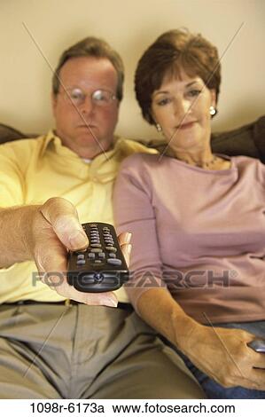 Stock Image - people, couple, eyeglasses, sitting, watch, Middle-aged, watching. Fotosearch
