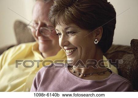 Stock Image - people, couple, eyeglasses, Middle-aged, brunette, indoors, Caucasian. Fotosearch