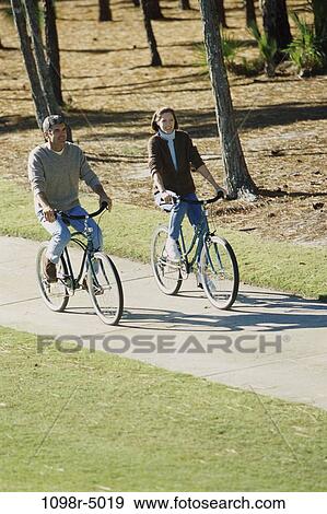 people, couple, Hispanic, outdoors, Middle-aged, bicycles, cycling View Large Photo Image Stock Photo - people, couple, Hispanic, outdoors, Middle-aged, bicycles, cycling. Fotosearch