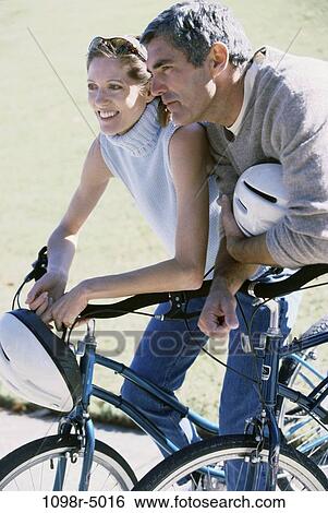people, couple, Hispanic, outdoors, Middle-aged, bicycles, cycling View Large Photo Image Stock Photograph - people, couple, Hispanic, outdoors, Middle-aged, bicycles, cycling. Fotosearch