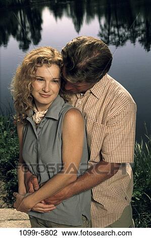 Stock Image - people, couple, lake, outdoors, romantic, romance, posing. Fotosearch