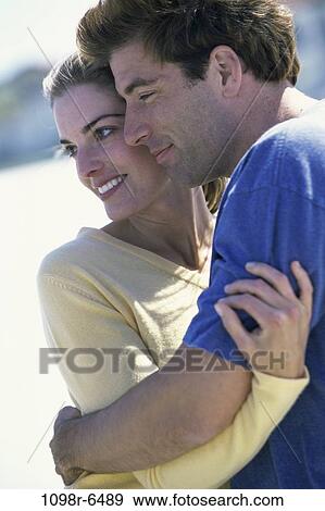 people, couple, outdoors, hugging, hug, Caucasian View Large Photo Image Stock Photo - people, couple, outdoors, hugging, hug, Caucasian. Fotosearch