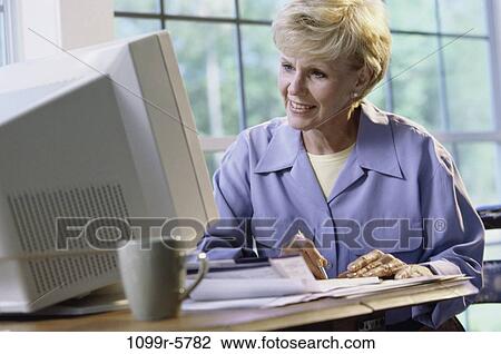 people, desk, woman, senior, computer, blond, finance View Large Photo Image Stock Image - people, desk, woman, senior, computer, blond, finance. Fotosearch