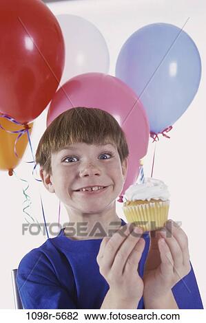 people, eating, party, balloons, boy, child, brunette View Large Photo Image Stock Image - people, eating, party, balloons, boy, child, brunette. Fotosearch