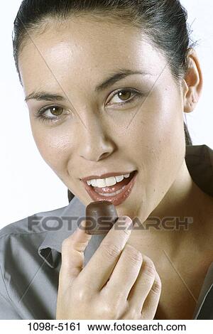 people, eating, woman, Hispanic, chocolate, candy, sweet View Large Photo Image Stock Image - people, eating, woman, Hispanic, chocolate, candy, sweet. Fotosearch