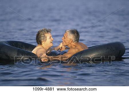 Stock Image - people, floating, water, couple, senior, lake, outdoors. Fotosearch