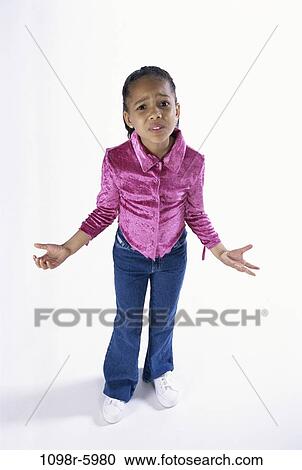 Stock Image - people, girl, frustrated, child, jeans, confused, indoors. Fotosearch
