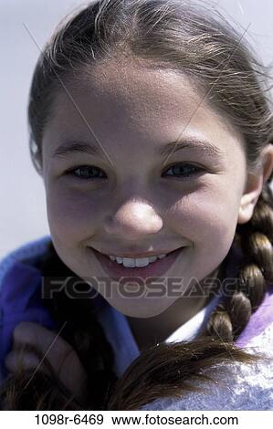 Stock Photo - people, girl, outdoors, child, brunette, headshot. Fotosearch