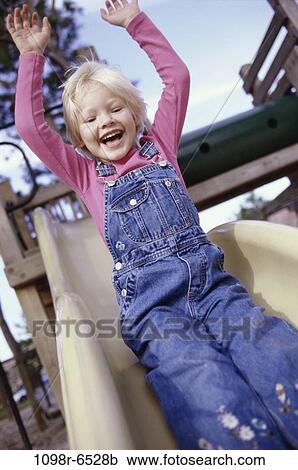 people, girl, sliding, playground, outdoors, child, blond View Large Photo Image Stock Image - people, girl, sliding, playground, outdoors, child, blond. Fotosearch