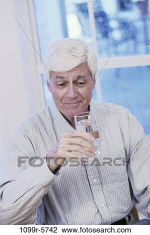 people, glass, water, home, senior, drinking View Large Photo Image Stock Image - people, glass, water, home, senior, drinking. Fotosearch