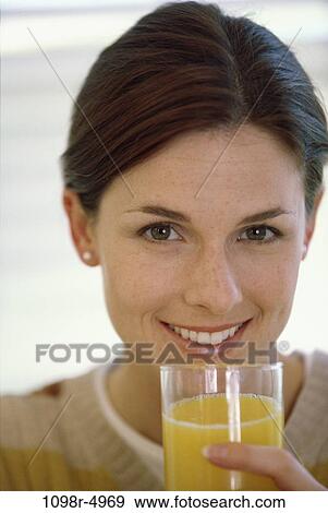 people, glass, woman, smiling, healthy, orange juice, drinking View Large Photo Image Stock Photo - people, glass, woman, smiling, healthy, orange juice, drinking. Fotosearch