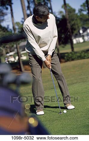 people, golf, concentration, outdoors, sports, Middle-aged View Large Photo Image Stock Image - people, golf, concentration, outdoors, sports, Middle-aged. Fotosearch