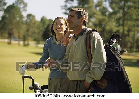 people, golf, couple, Hispanic, outdoors, Middle-aged, brunette View Large Photo Image Stock Image - people, golf, couple, Hispanic, outdoors, Middle-aged, brunette. Fotosearch