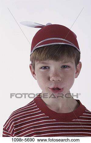 Stock Image - people, hat, boy, cap, child, humor, brunette. Fotosearch