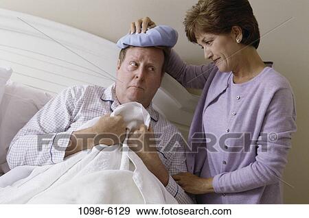 people, headache, couple, bed, cold, nurturing, Middle-aged View Large Photo Image Stock Photo - people, headache, couple, bed, cold, nurturing, Middle-aged. Fotosearch