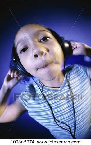 people, headset, listening, music, girl, child, indoors View Large Photo Image Picture - people, headset, listening, music, girl, child, indoors. Fotosearch