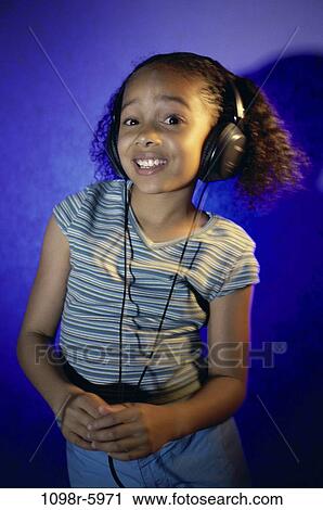 people, headset, listening, music, girl, child, indoors View Large Photo Image Stock Image - people, headset, listening, music, girl, child, indoors. Fotosearch