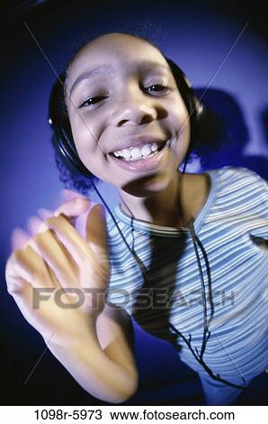 people, headset, listening, music, girl, child, indoors View Large Photo Image Stock Image - people, headset, listening, music, girl, child, indoors. Fotosearch