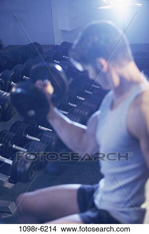 Picture - people, healthy, health, lifting, weights, brunette. Fotosearch