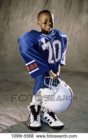 people, helmet, football, boy, uniform, indoors, player View Large Photo Image Stock Photo - people, helmet, football, boy, uniform, indoors, player. Fotosearch