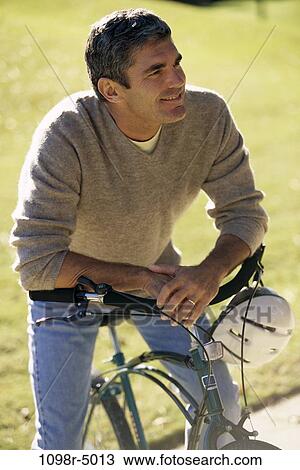 people, Hispanic, bicycle, helmet, outdoors, Middle-aged View Large Photo Image Stock Image - people, Hispanic, bicycle, helmet, outdoors, Middle-aged. Fotosearch