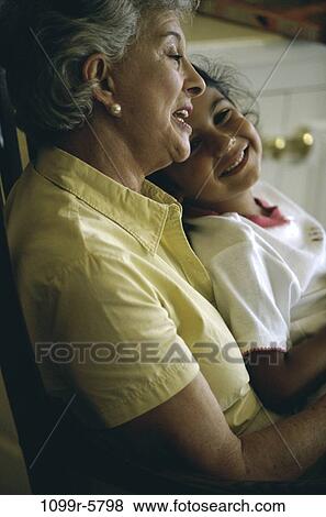 people, Hispanic, family, granddaughter, indoors, grandmother, grandparent View Large Photo Image Stock Photo - people, Hispanic, family, granddaughter, indoors, grandmother, grandparent. Fotosearch