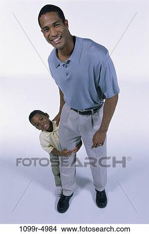 people, holding, leg, family, father, hold View Large Photo Image Picture - people, holding, leg, family, father, hold. Fotosearch