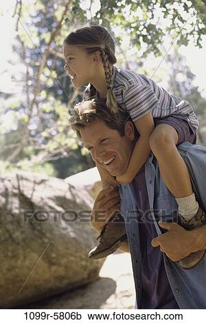Stock Image - people, holding, outdoors, family, father, daughter, hold. Fotosearch