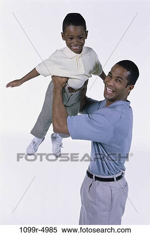 people, holding, playful, lifting, family, father View Large Photo Image Stock Photography - people, holding, playful, lifting, family, father. Fotosearch