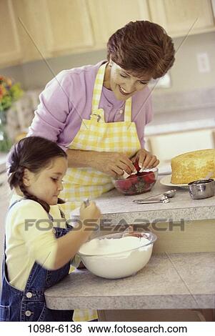 people, home, Hispanic, cooking, cake, family, food View Large Photo Image Stock Photograph - people, home, Hispanic, cooking, cake, family, food. Fotosearch