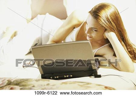 people, home, woman, eyeglasses, computer, laptop View Large Photo Image Stock Image - people, home, woman, eyeglasses, computer, laptop. Fotosearch