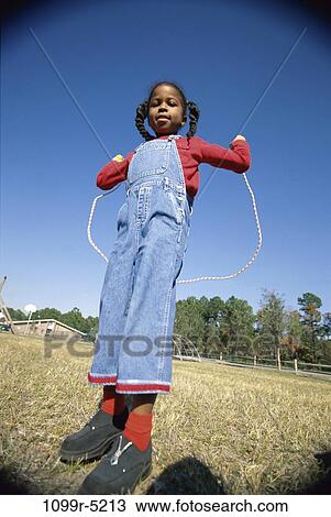 people, jump, jumping, girl, outdoors, child, game View Large Photo Image Stock Image - people, jump, jumping, girl, outdoors, child, game. Fotosearch