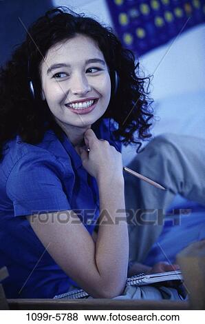 people, listening, music, indoors, teenager, female View Large Photo Image Stock Photo - people, listening, music, indoors, teenager, female. Fotosearch