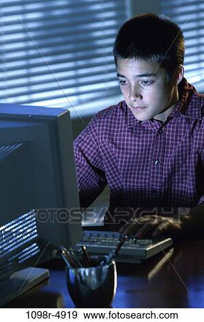 people, male, Hispanic, computer, concentrating, serious, using View Large Photo Image Stock Photo - people, male, Hispanic, computer, concentrating, serious, using. Fotosearch