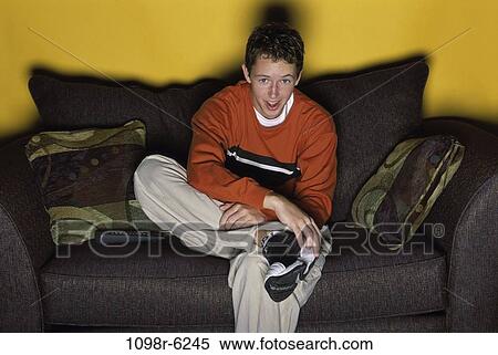 people, male, watch, couch, watching, television, brunette View Large Photo Image Stock Photography - people, male, watch, couch, watching, television, brunette. Fotosearch