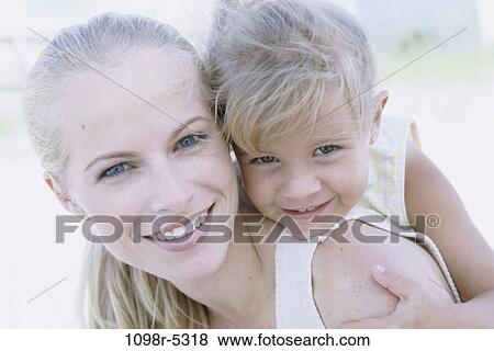 Stock Photo - people, mother, outdoors, hugging, family, blond, hug. Fotosearch